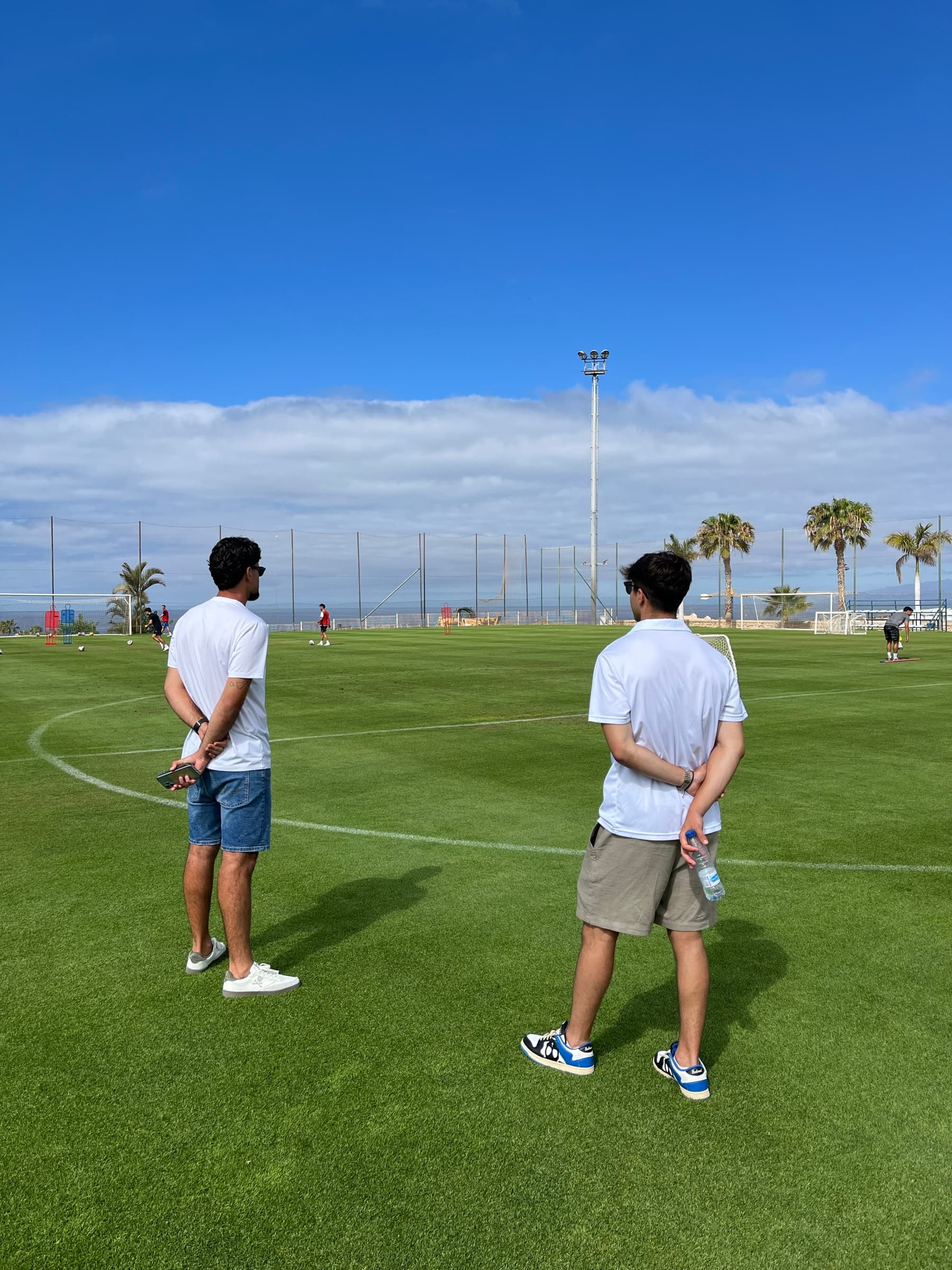 Two coaches looking over the Tenerife training base